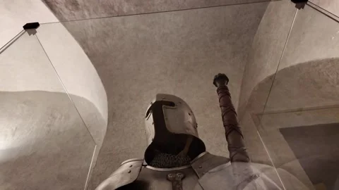 Medieval knight's armor with a big two-handed sword in castle museum Stock Footage 314059387
