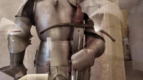 Medieval knight's armor with a big two-handed sword next to it - castle museum Stock Footage 314107326