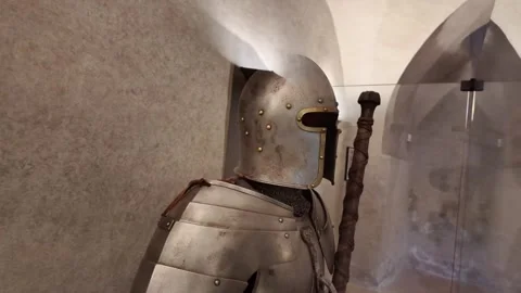 Medieval knight's armor with a big two-handed sword in castle museum - 4K Stock Footage 314107334