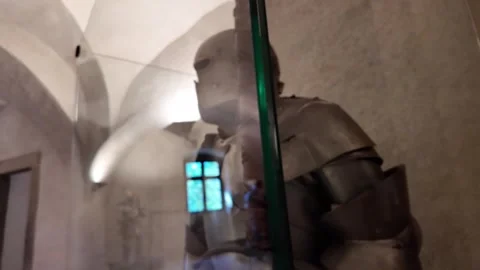 Medieval knight's armor with a two-handed sword next to it - castle museum Stock Footage 314107327