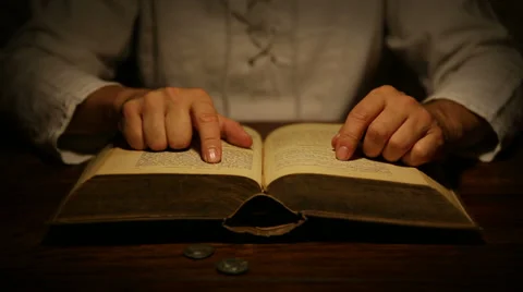 Medieval looking man is reading a old book Video stock 29847733