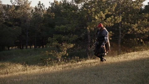 Medieval man walking through the forest Stock Footage 278519443