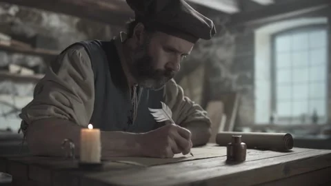 Medieval master writing text with a quill pen on a geometric drawing Stock Footage 342016577