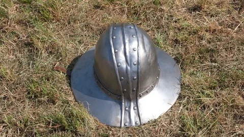Medieval Metal Hat on grass Stock Footage 113186800