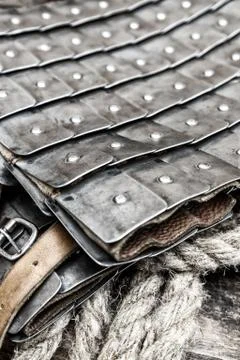 Medieval military armor pattern collected from iron plates on a leather vest Stock Photos