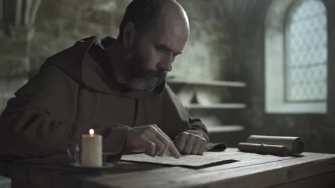 Medieval monk reading a psalm sheet, guiding a finger along text, medium shot Stock Footage 338991064