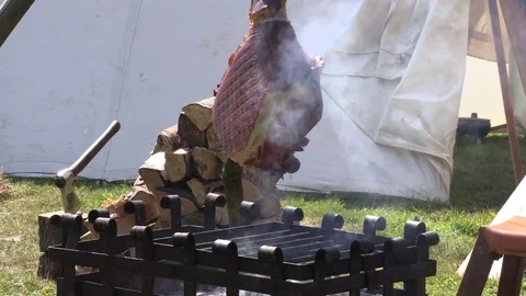Medieval Pork meat cooking on an open coal fire 库存影片 79774797