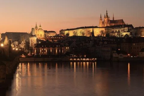 Medieval Prague Castle complex above the Vltava River, night scene Stock Photos
