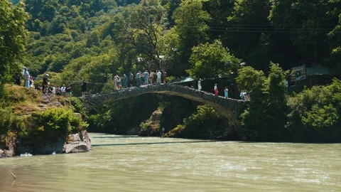 Medieval queen tamar stone bridge over mountain river in georgia Video stock 346777519