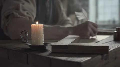Medieval scholar creating a geometry drawing with a quill pen Stock Footage 339231503