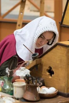 Medieval scribe writing calligraphy Stock Photos