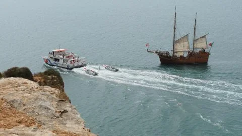 Medieval ship on the coast Stock Photos