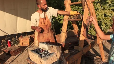 Medieval Smith is Using Bellows at the Historical Festival Stock Footage 65020714