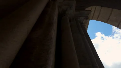 Medieval stone arches through which the sun's rays filter through Stock Footage 286244173