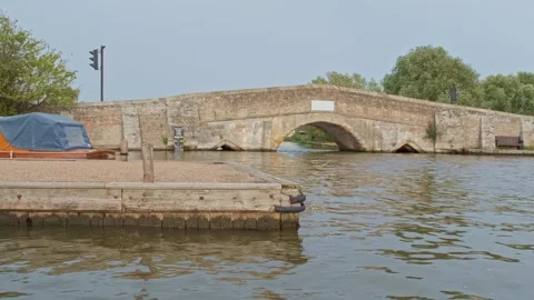 Medieval stone bridge over the river Video stock 252516836