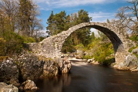 Medieval stone bridge over a river, carrbridge, scotland Stock Photos