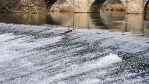 Medieval stone bridge, puente mayor, crossing carrion river, palencia, spain Stock Footage 124570345