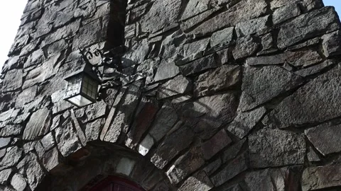 Medieval stone castle wall with sunlight moving across the facade Stock Footage 341907320