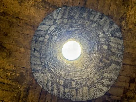 Medieval stone cavern ceiling with centered tower Stock Photos