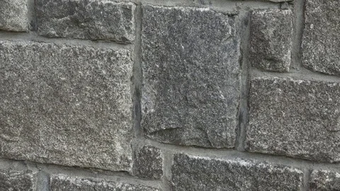 Medieval stone wall. A masonry wall. Stone wall texture background Stock Footage 79414371