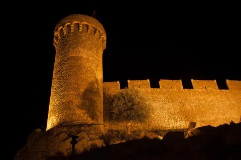 Medieval Stone Wall With Round Tower At Night Фото