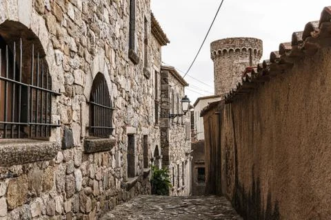 Medieval street with a tower at the back Stock Photos