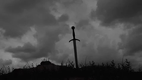 A Medieval Sword Stuck in the Ground in a Middle of a Winter Field Stock Footage 302550398