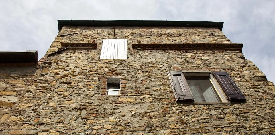 Medieval textured stone wall facade at Castle of Serravalle. Italy Stock Photos