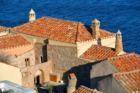 Medieval tiled rooftops with chimneys Stock Photos