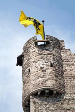Medieval tower with flag Stock Photos