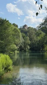 Medieval Tower Green Forest River Water Reflection Sky Foto stock