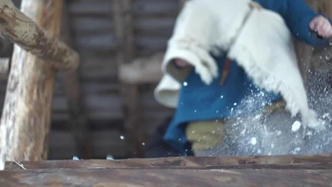 Medieval traders walk down stairs with snow in slow-mo Stockbeeldmateriaal 89120241