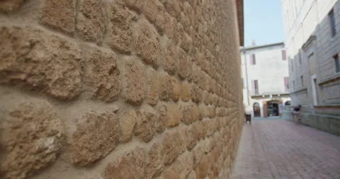 Medieval tuff stone wall in a tuscan village street Vídeo Stock 340589042