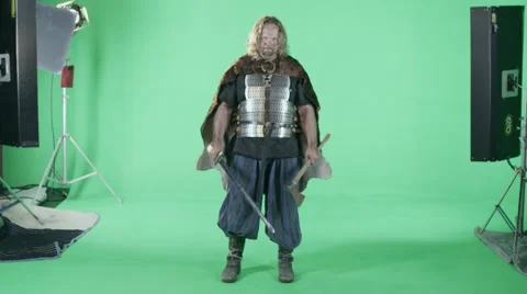 A Medieval Viking Warrior Prepares For Battle (Green Screen). Stock Footage