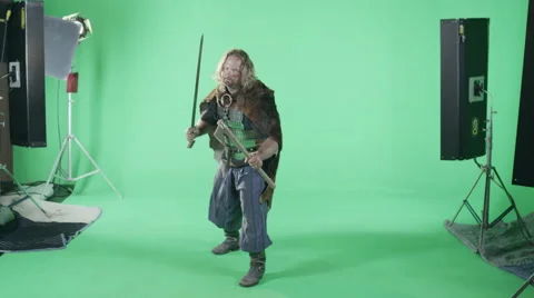 A Medieval Warrior Readies Himself For Battle In Front Of A Green Screen. Stock Footage 45974741