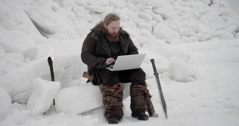 Medieval warrior sitting on ice block Stock Footage 106082309