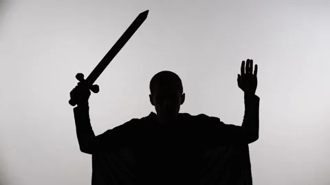 Medieval warrior with a sword raised his hands up Stock Footage 167602989