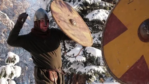 Medieval warriors fighting in a winter forest with swords in armor 스톡 동영상 70870727