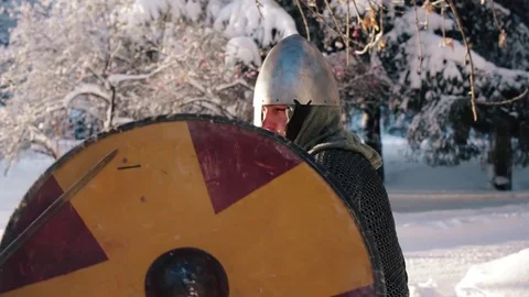 Medieval warriors fighting in a winter forest with swords in armor Stock Footage 70870765