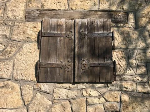 Medieval window at a citadel. The window is close. Stock Photos