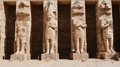 Medinet Habu temple first courtyard with Osiride pillars and Ramses III statues Stock Footage 329123740