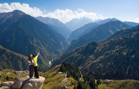 Meditating couple at summit Foto stock