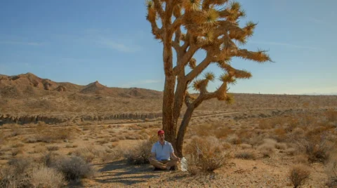 Meditating in desert Stock Footage