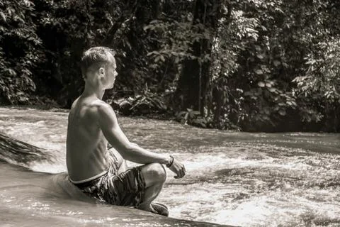 Meditating guy Stock Photos