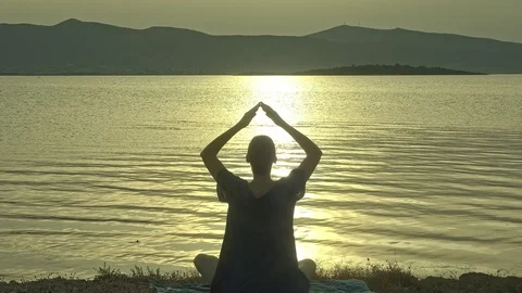 Meditating By A Lake Stock Footage 112958233