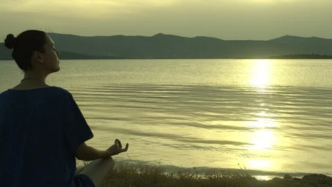 Meditating By The Ocean Stock Footage 112957123