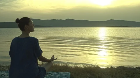 Meditating By The Sea Stock Footage 112359795