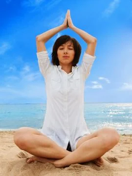 Meditation on the beach Stock Photos