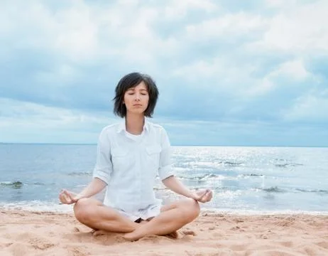 Meditation on the beach Stock Photos