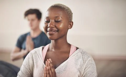 Meditation is both the means and the end. Cropped shot of an attractive young Stock Photos